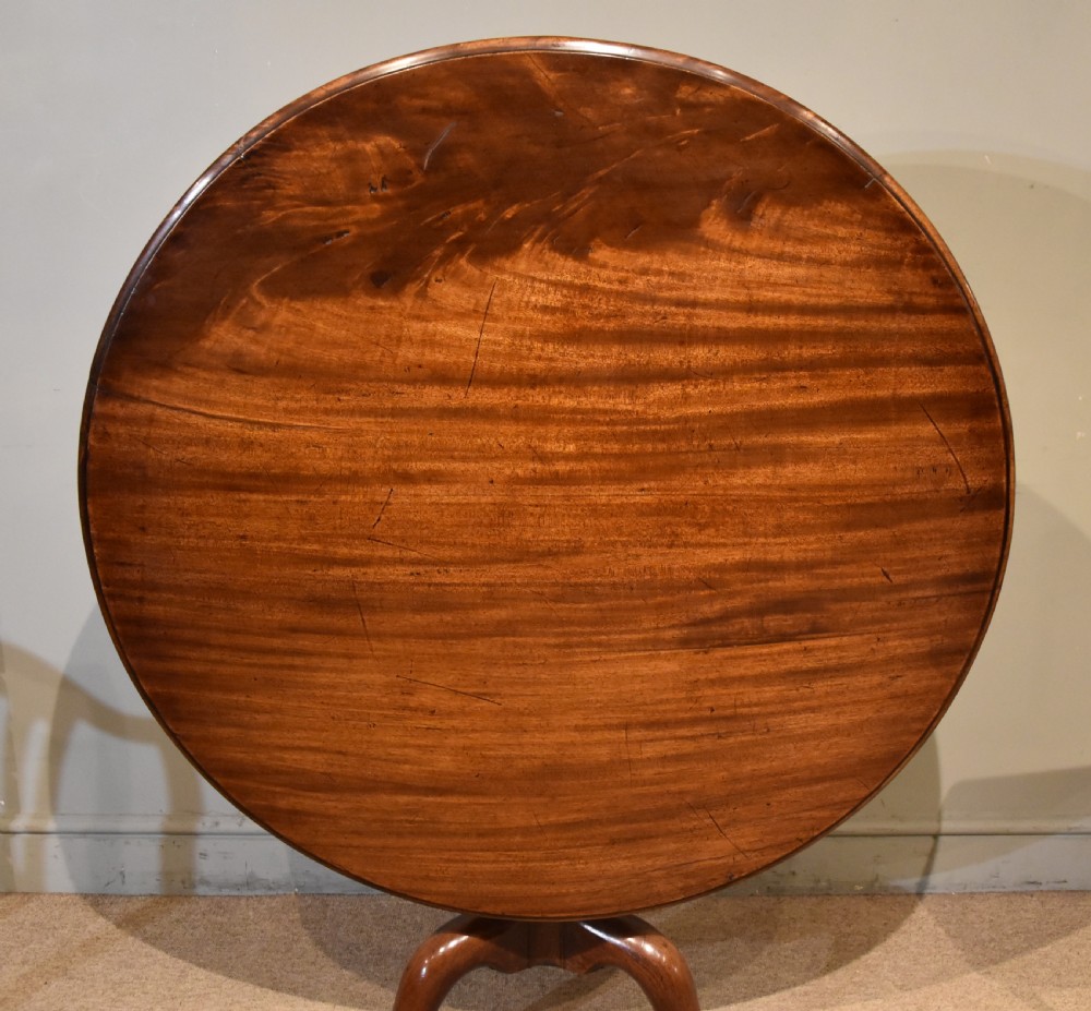 Large George III tilt-top mahogany centre table View II