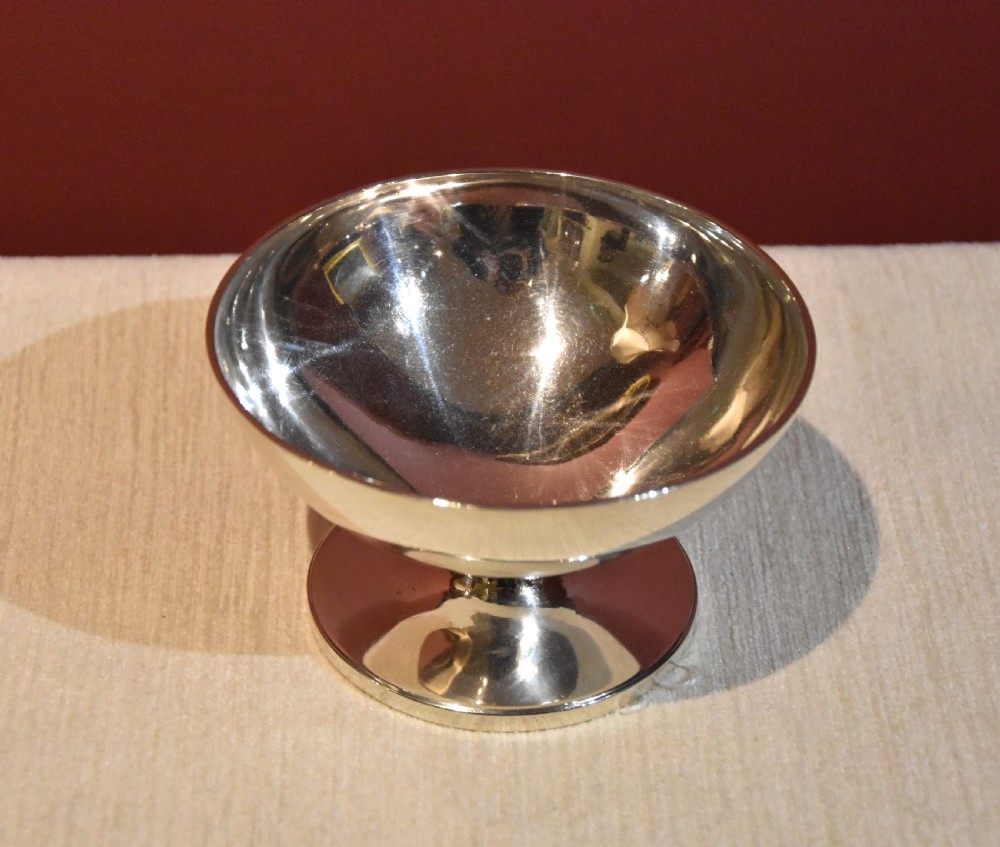 A polished George III sterling silver footed pedestal bowl with a plain circular body and spreading circular foot. View II