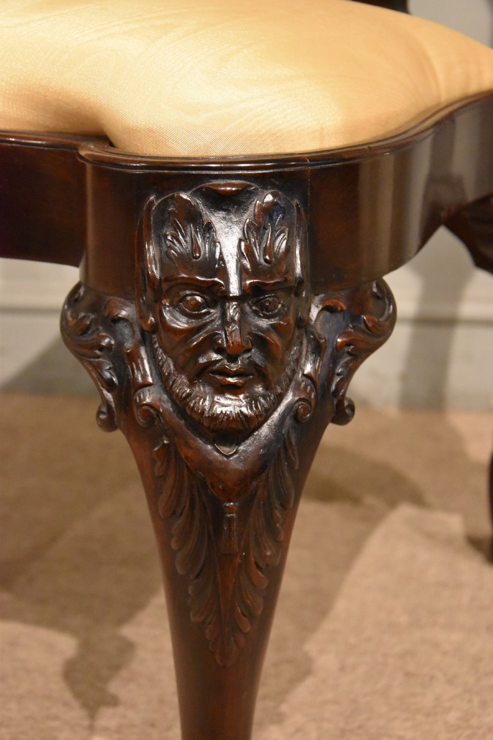A 19th-century Cuban mahogany side chair featuring an openwork carved back, gold fabric seat, and cabriole legs with claw and ball feet. View V