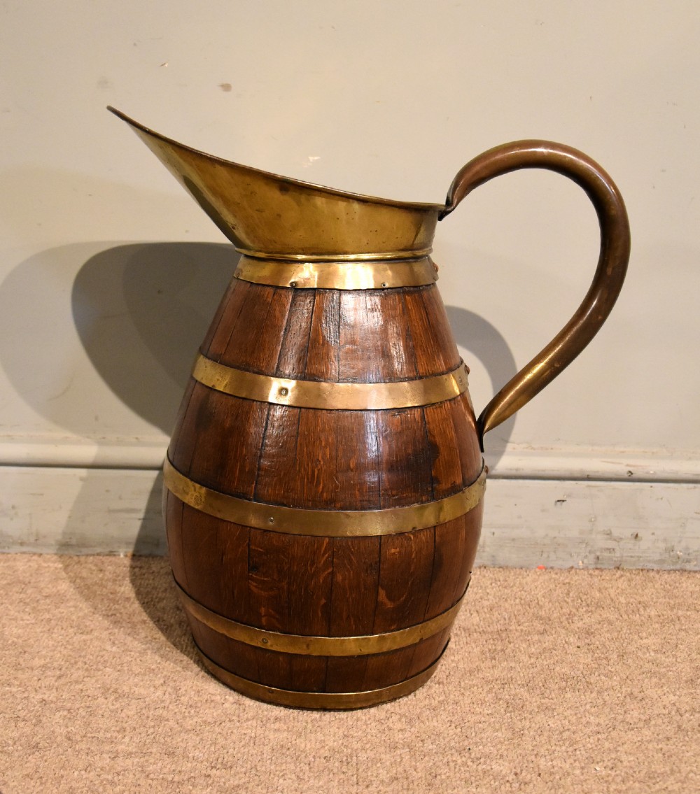 Large Victorian oak and brass bound pitcher jug