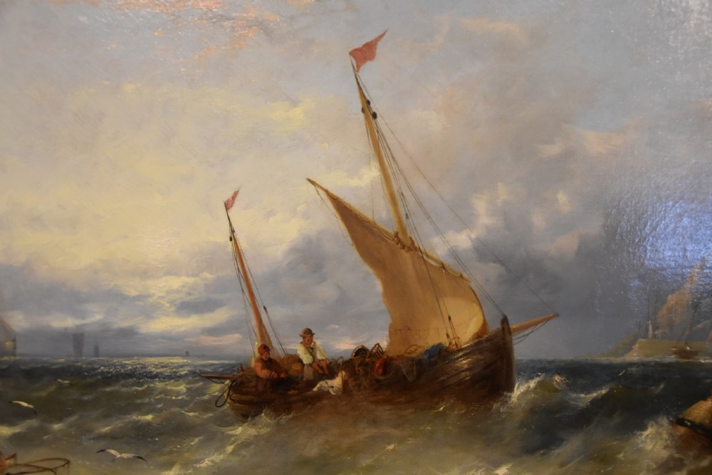 A Victorian oil painting depicting fishing boats on turbulent waters off St Michaels Mount set within an ornate gold gilt frame. View V