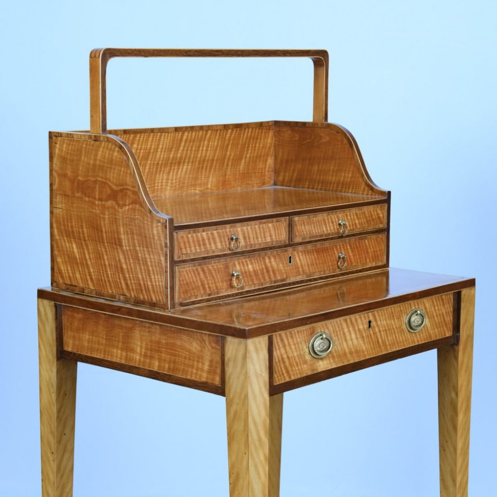 An 18th-century Georgian satinwood cheveret writing table featuring slender tapered legs, a lower drawer, and an upper removable book trough with handle. View VII