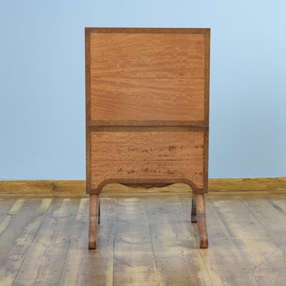 A 19th-century French satinwood folding tea table featuring two tiers, scroll-shaped uprights, crossbanded borders, and splayed trestle legs. View IV
