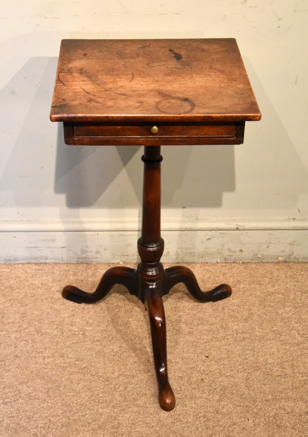 Mid-18th-century mahogany wine table featuring a rectangular top with a small drawer, supported by a turned central stem and three cabriole legs. View III