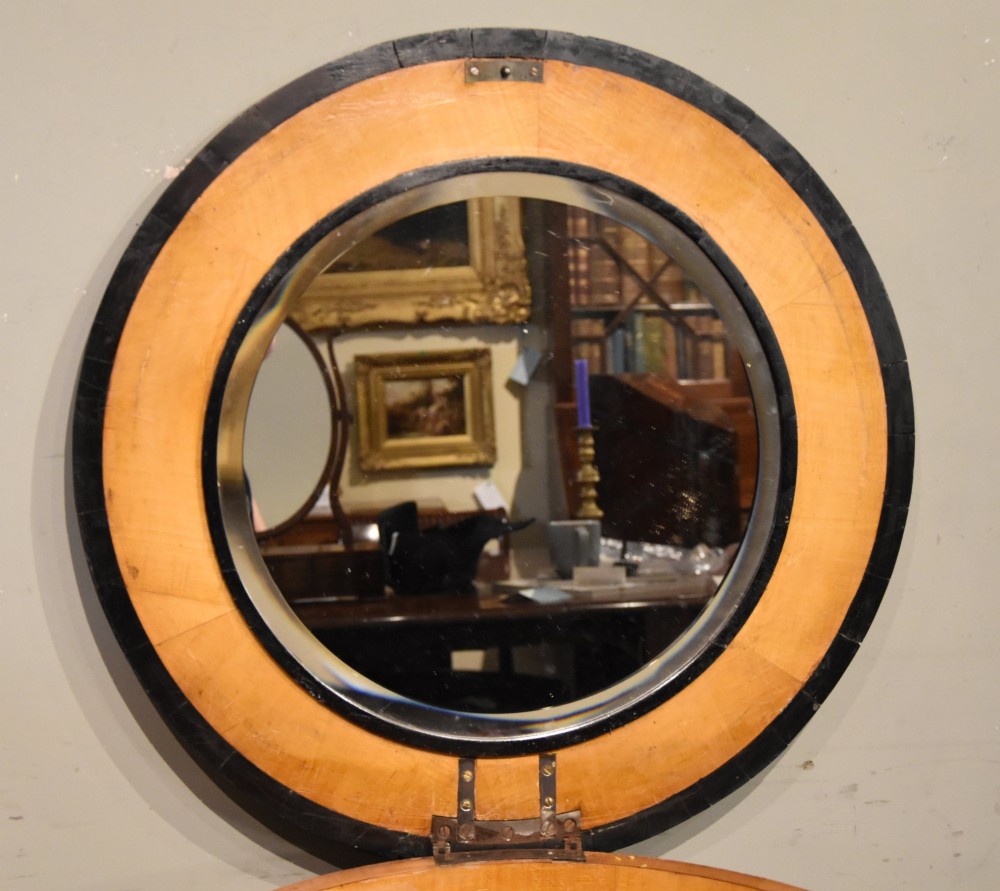 A circular Biedermeier centre table featuring a painted classical top panel, golden birch veneer apron with key, ebonised trim, and a tripod base. View VI