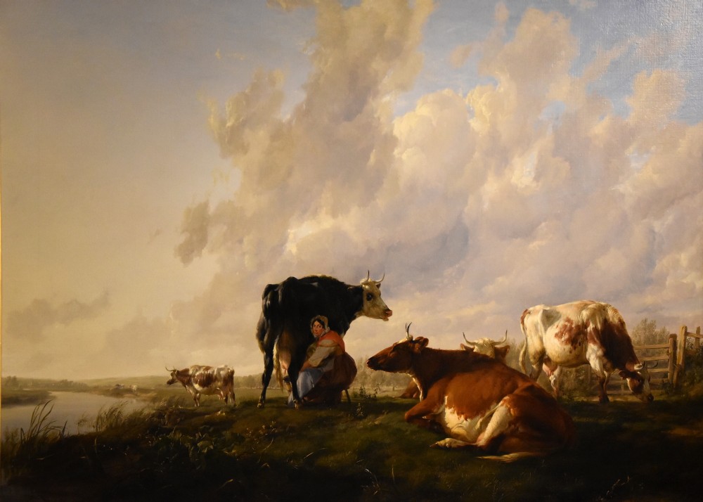 A 19th-century Victorian pastoral oil painting featuring cattle and a milkmaid near a river in an intricate gilded frame. View II