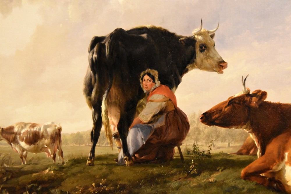 A 19th-century Victorian pastoral oil painting featuring cattle and a milkmaid near a river in an intricate gilded frame. View V