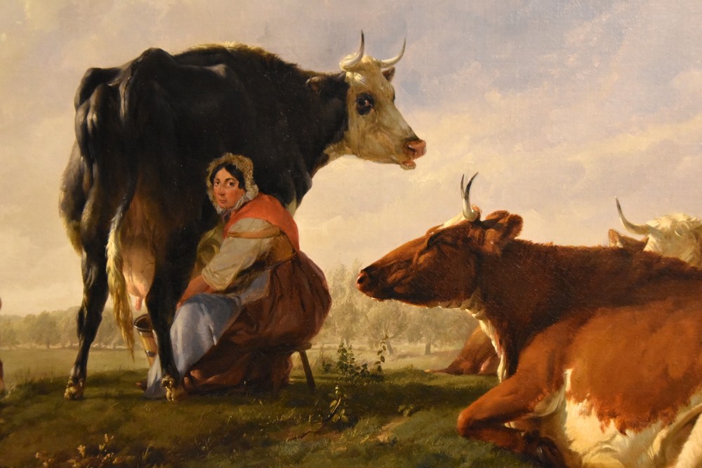 A 19th-century Victorian pastoral oil painting featuring cattle and a milkmaid near a river in an intricate gilded frame. View VII