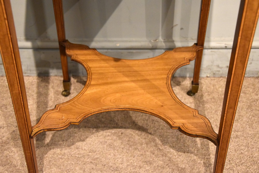 A Sheraton period mahogany writing table featuring folding side leaves, a green leather inset writing surface, diamond marquetry inlay, and a lower shaped stretcher. View VIII