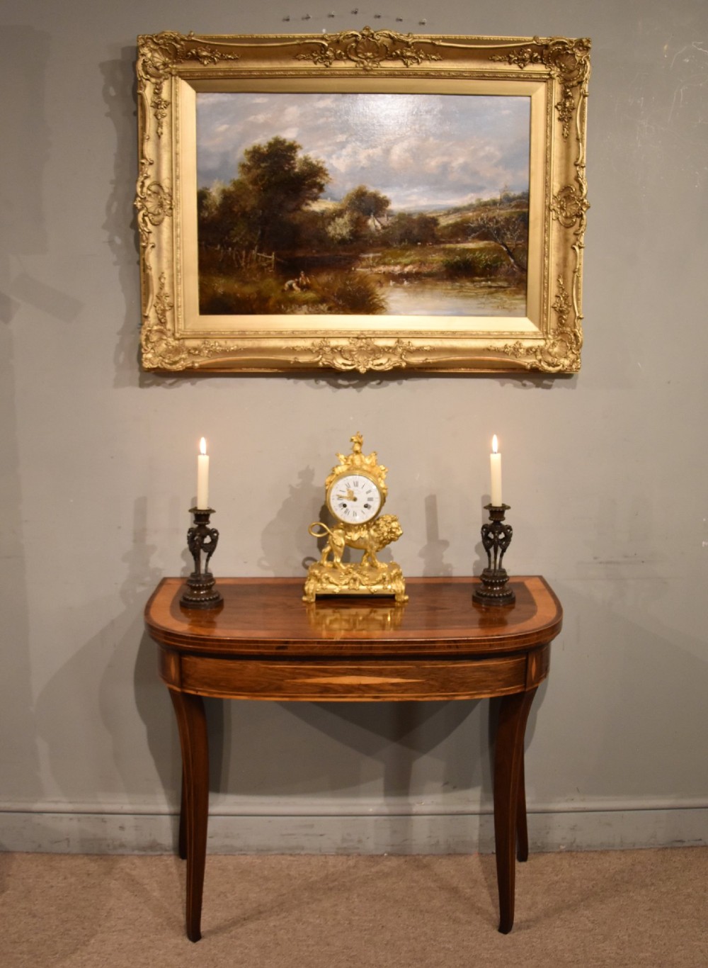 A Regency rosewood foldover card table featuring satinwood crossbanding and an inlaid diamond motif on swept legs. View III