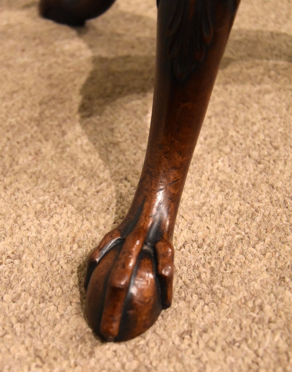 An 18th-century carved mahogany kettle stand with a hexagonal top, turned spiral column, and tripod cabriole legs ending in claw-and-ball feet. View IV