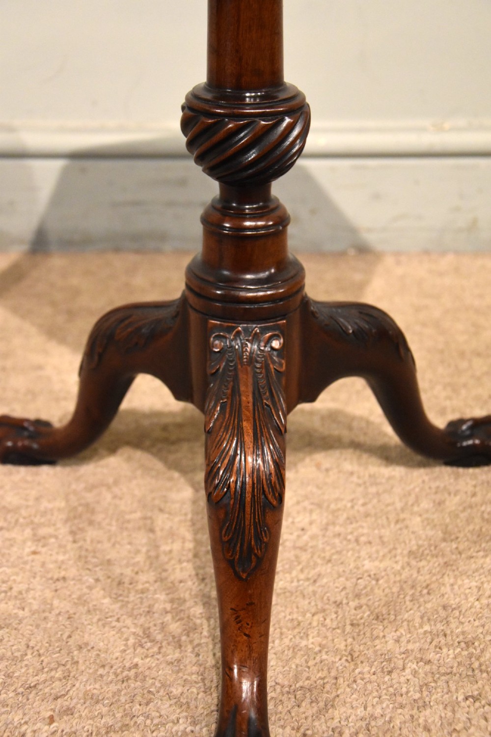 An 18th-century carved mahogany kettle stand with a hexagonal top, turned spiral column, and tripod cabriole legs ending in claw-and-ball feet. View VI