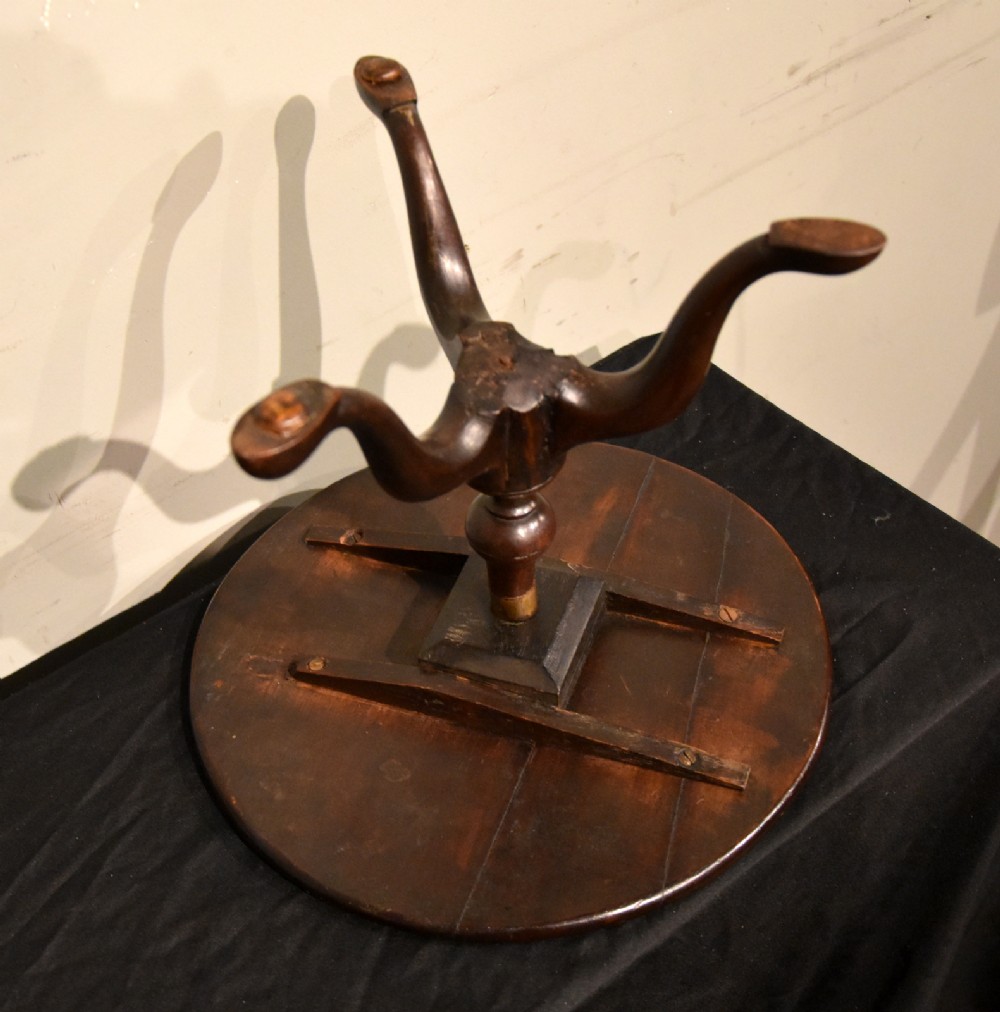 A George III miniature mahogany tripod table with a circular top, turned central column, and cabriole legs terminating in pad feet. View VII