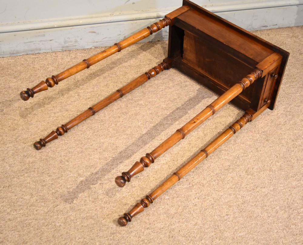 A tall, slender Regency West Indian wooden side table featuring bamboo-turned legs, a raised gallery top, and a small single end drawer. View VII