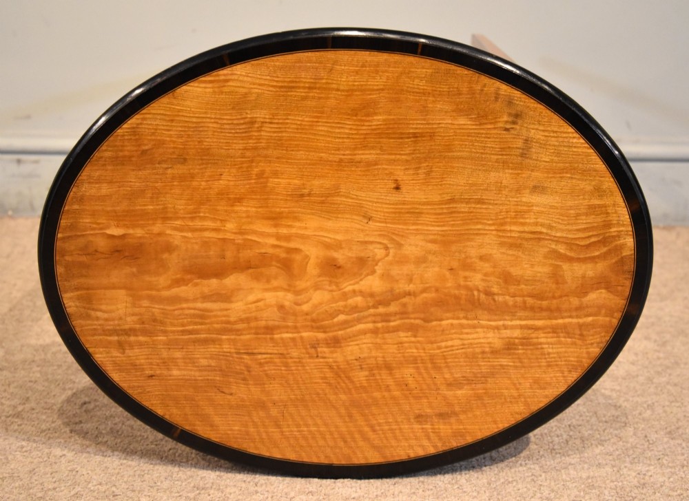 A late 18th-century oval satinwood occasional table featuring a dark banded top border and slender square tapered legs. View IV