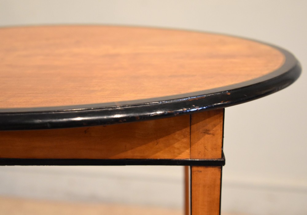 A late 18th-century oval satinwood occasional table featuring a dark banded top border and slender square tapered legs. View VI