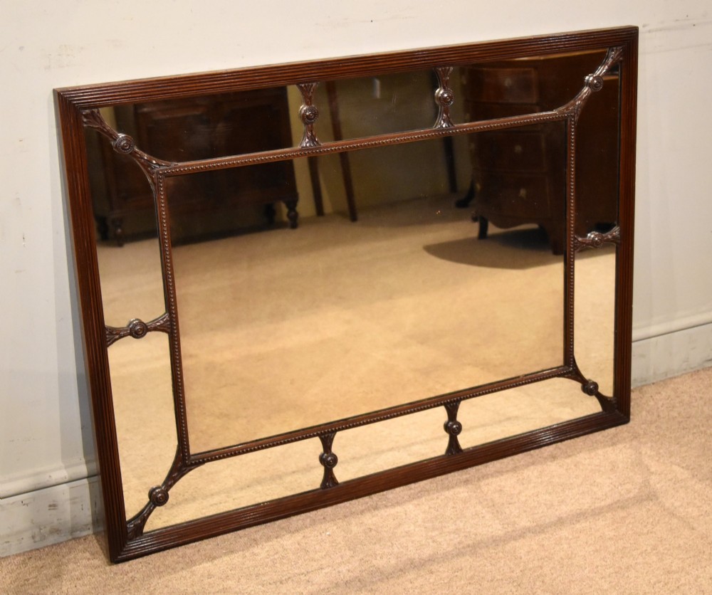 A large rectangular 19th-century mahogany wall mirror featuring a reeded outer frame and decorative carved rosettes on internal sectioning lines. View II