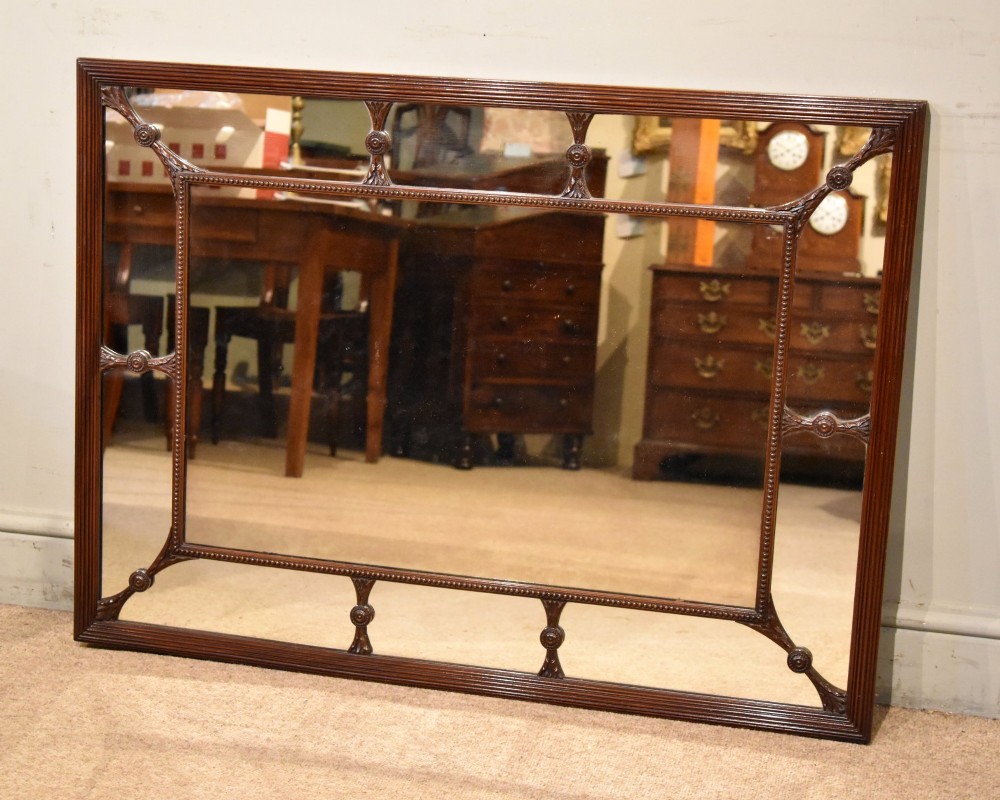 A large rectangular 19th-century mahogany wall mirror featuring a reeded outer frame and decorative carved rosettes on internal sectioning lines. View III