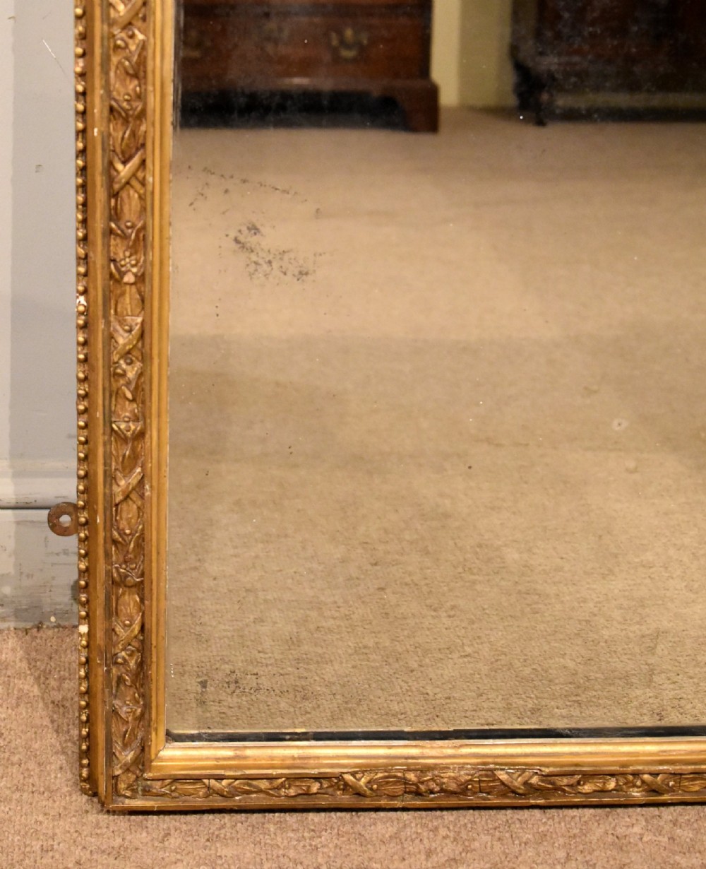 A tall 19th-century full-length mirror featuring an arched gold gilded frame with beaded and foliate moulding. View IV