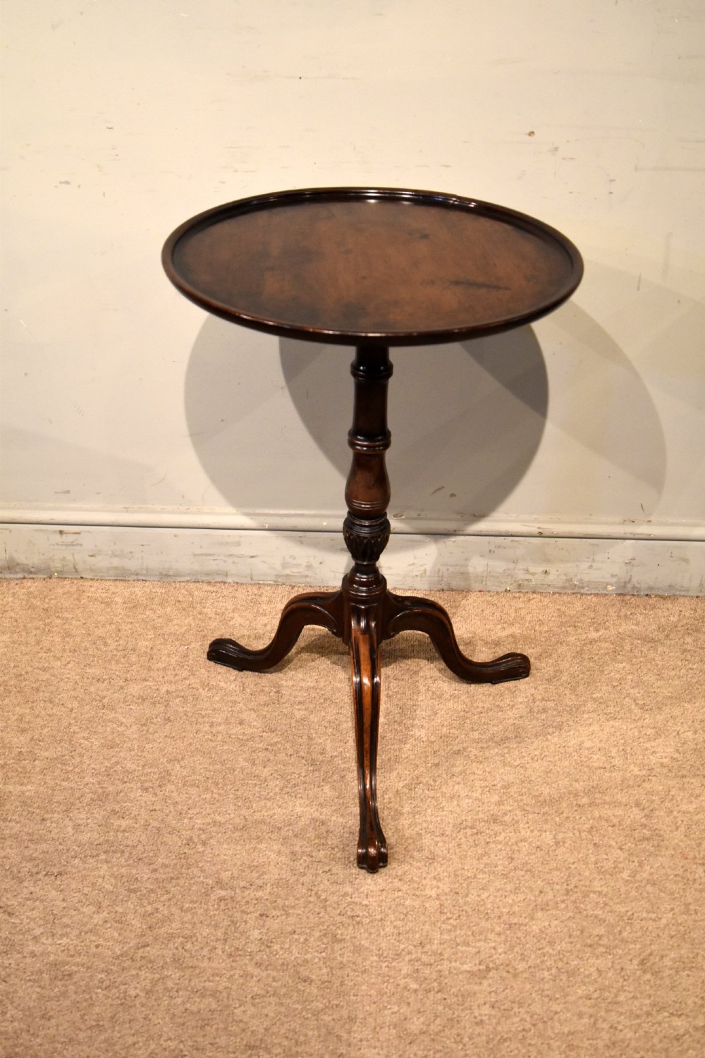 An 18th-century Hepplewhite mahogany wine table featuring a circular dish top, turned central pedestal, and tripod legs. View III