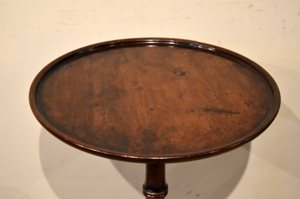 An 18th-century Hepplewhite mahogany wine table featuring a circular dish top, turned central pedestal, and tripod legs. View IV