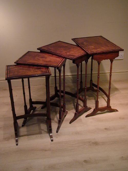 AN EXCEPTIONAL NEST OF TABLES - ADDITIONAL PHOTO 1