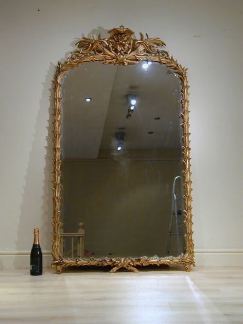 A MAGNIFICENT GILTFRAMED MIRROR - ADDITIONAL PHOTO 1