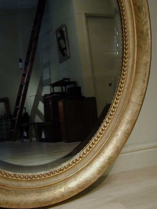 AN IMPRESSIVELY LARGE OVAL WALL MIRROR - ADDITIONAL PHOTO 4