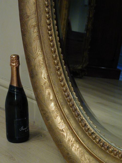 AN IMPRESSIVELY LARGE OVAL WALL MIRROR - ADDITIONAL PHOTO 5
