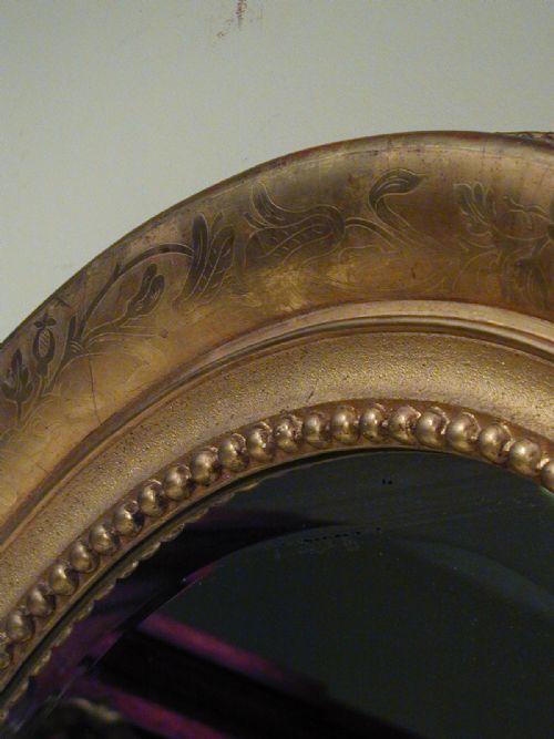 AN IMPRESSIVELY LARGE OVAL WALL MIRROR - ADDITIONAL PHOTO 6