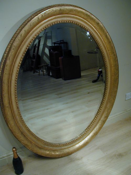 AN IMPRESSIVELY LARGE OVAL WALL MIRROR - ADDITIONAL PHOTO 11