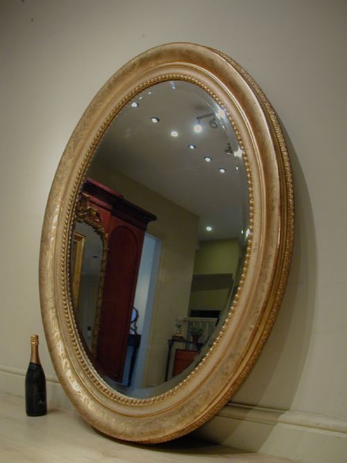 AN IMPRESSIVELY LARGE OVAL WALL MIRROR - ADDITIONAL PHOTO 13