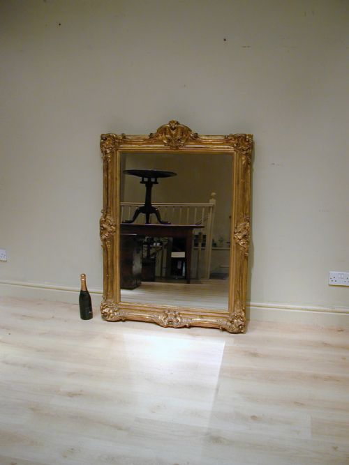 AN IMPRESSIVE GILTFRAME MIRROR - ADDITIONAL PHOTO 1