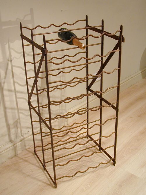 a doublesided vintage wine rack - CATEGORY: ANTIQUE MISCELLANEOUS - DATED 1910