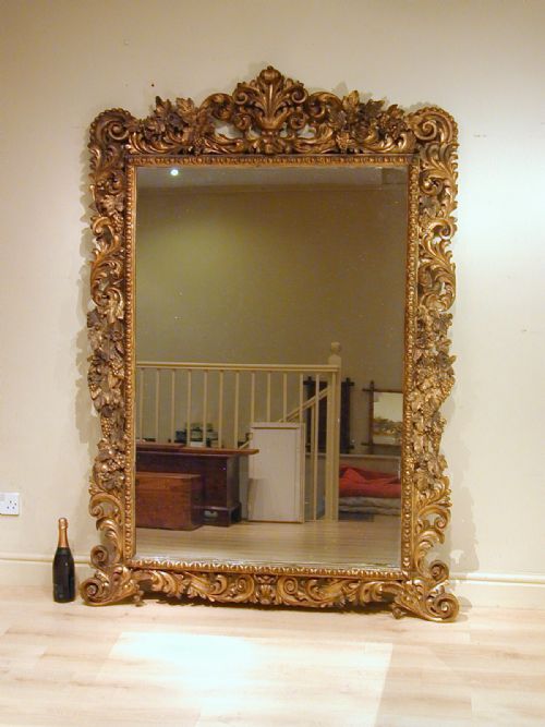 a large giltwood mirror of exceptional quality - CATEGORY: ANTIQUE MIRRORS - DATED 1750