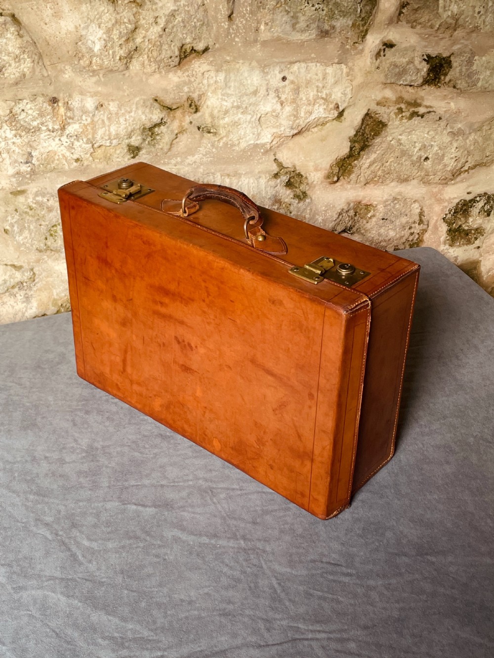 Luggage: a top quality leather suitcase View VIII