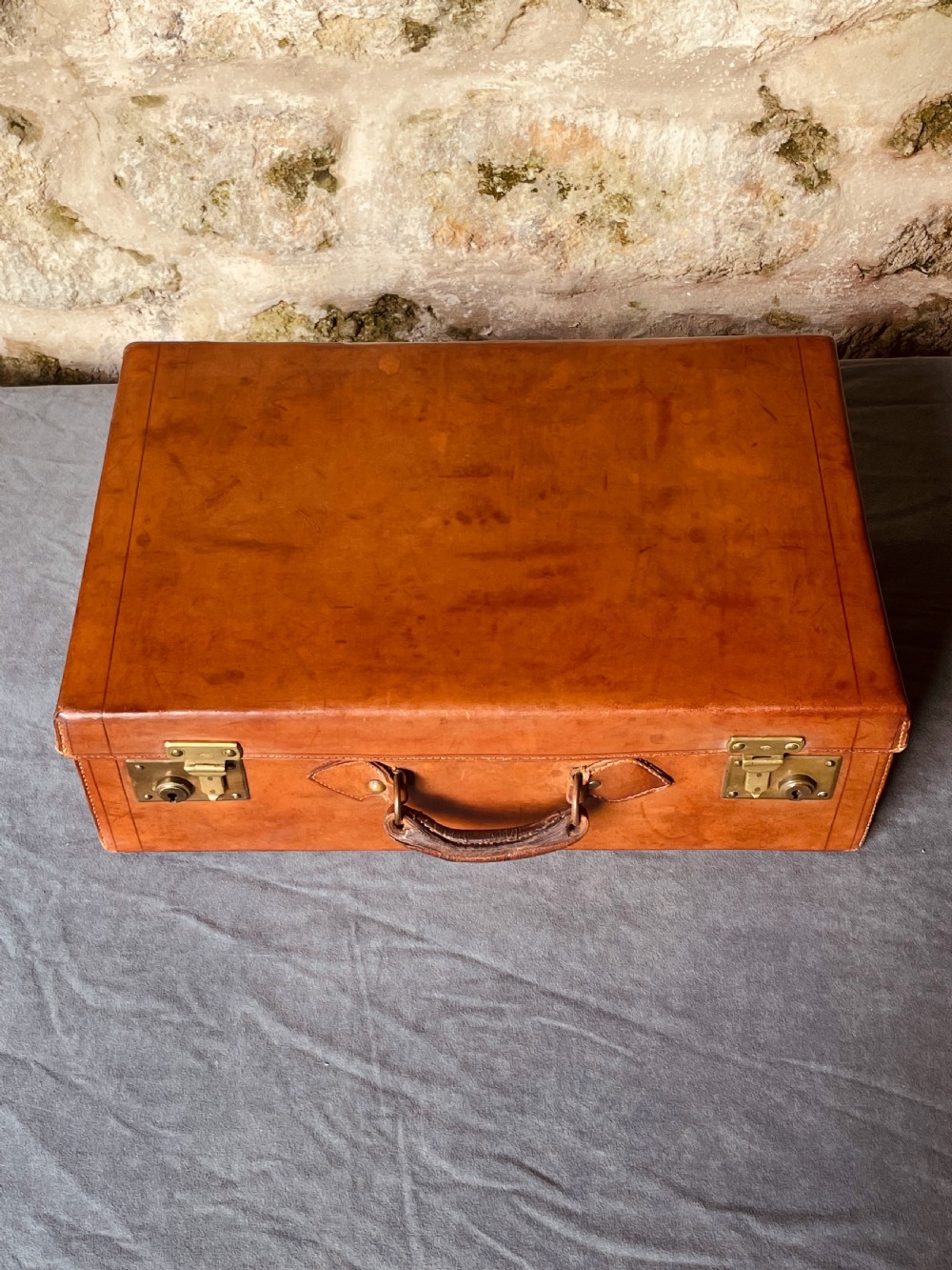 Luggage: a top quality leather suitcase View IX