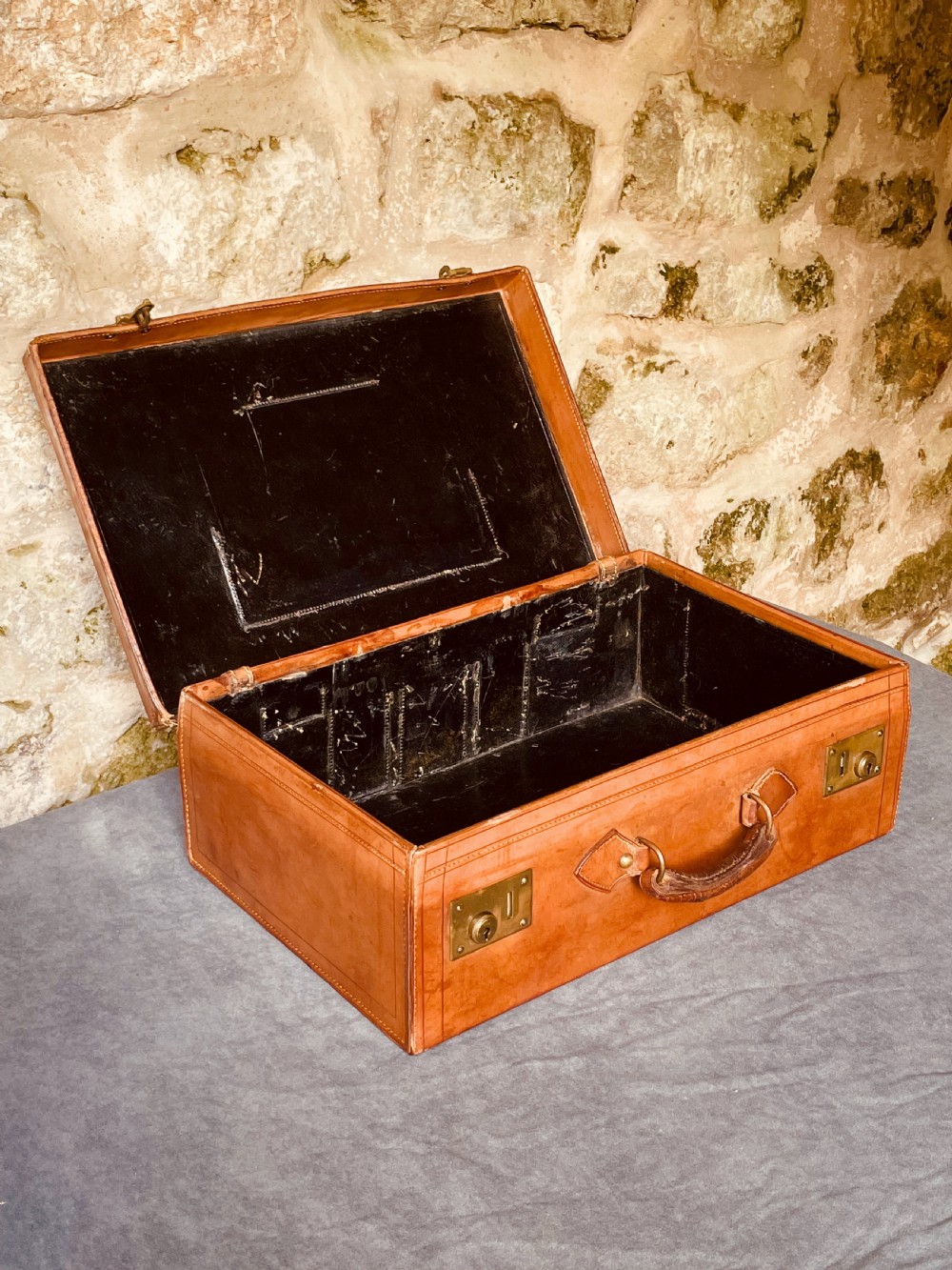 Luggage: a top quality leather suitcase View XIX