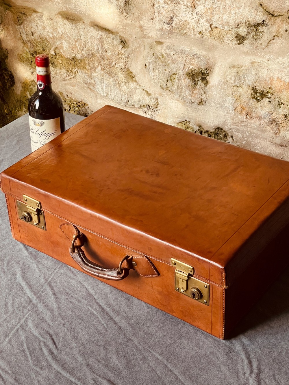 Luggage: a top quality leather suitcase View XXVI