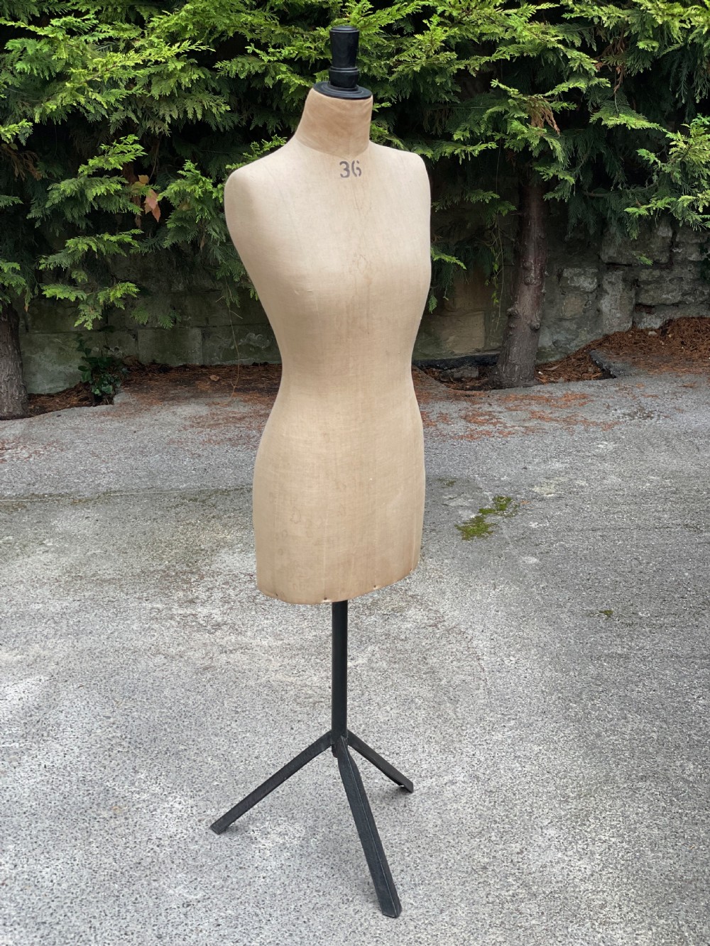 A fabric-covered female tailors dummy torso featuring stitched neutral linen upholstery and a dark turned neck finial. View III