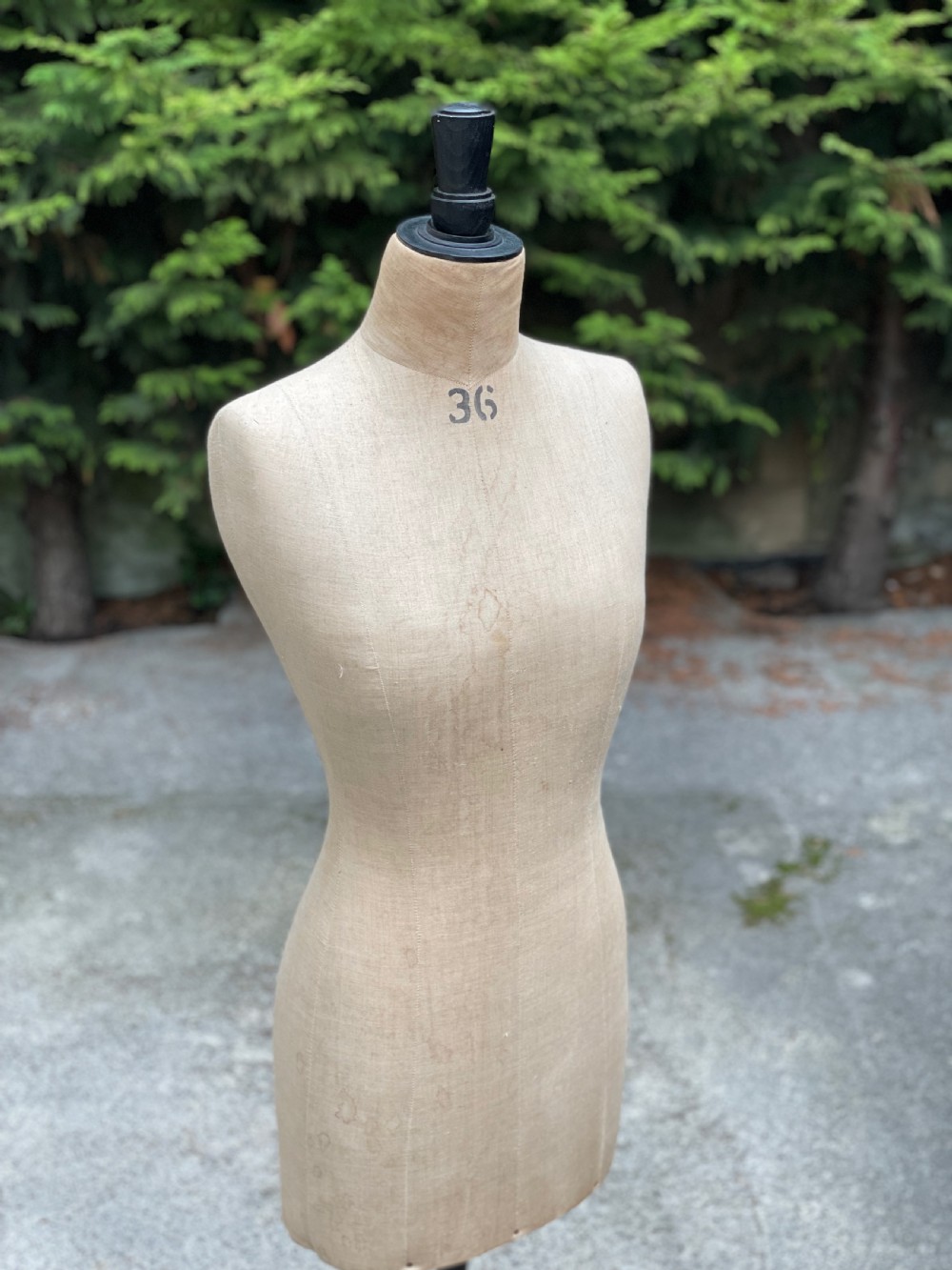 A fabric-covered female tailors dummy torso featuring stitched neutral linen upholstery and a dark turned neck finial. View IV