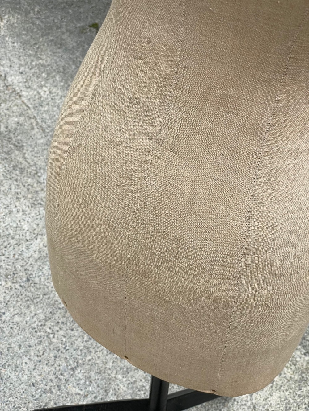 A fabric-covered female tailors dummy torso featuring stitched neutral linen upholstery and a dark turned neck finial. View XIX