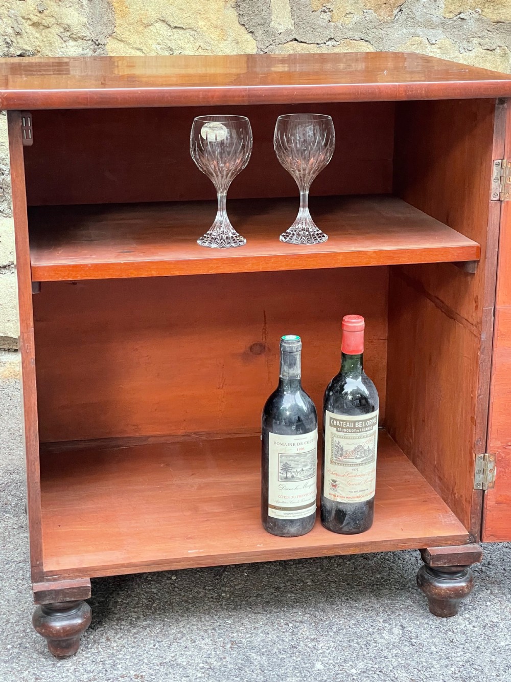 A Victorian warm brown wooden chest featuring four horizontal drawers with matching wooden knob handles and turned feet. View IX
