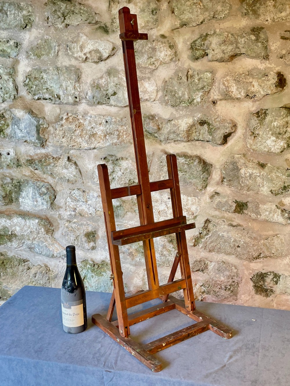 An early twentieth-century wooden tabletop artist easel with an adjustable central mast and wing nut fixings. View XI