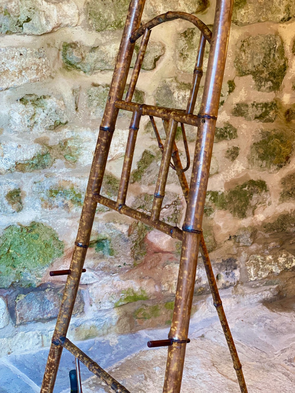 A tall Victorian freestanding easel crafted from mottled brown bamboo with cross-bracing and support pegs. View XVII