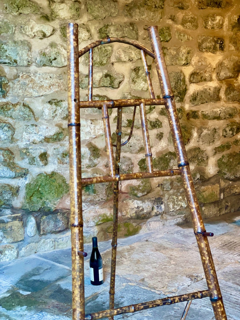A tall Victorian freestanding easel crafted from mottled brown bamboo with cross-bracing and support pegs. View XIX
