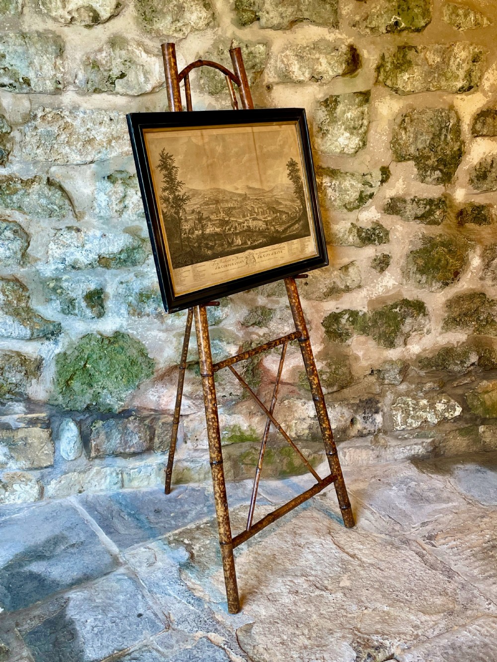 A tall Victorian freestanding easel crafted from mottled brown bamboo with cross-bracing and support pegs. View XX