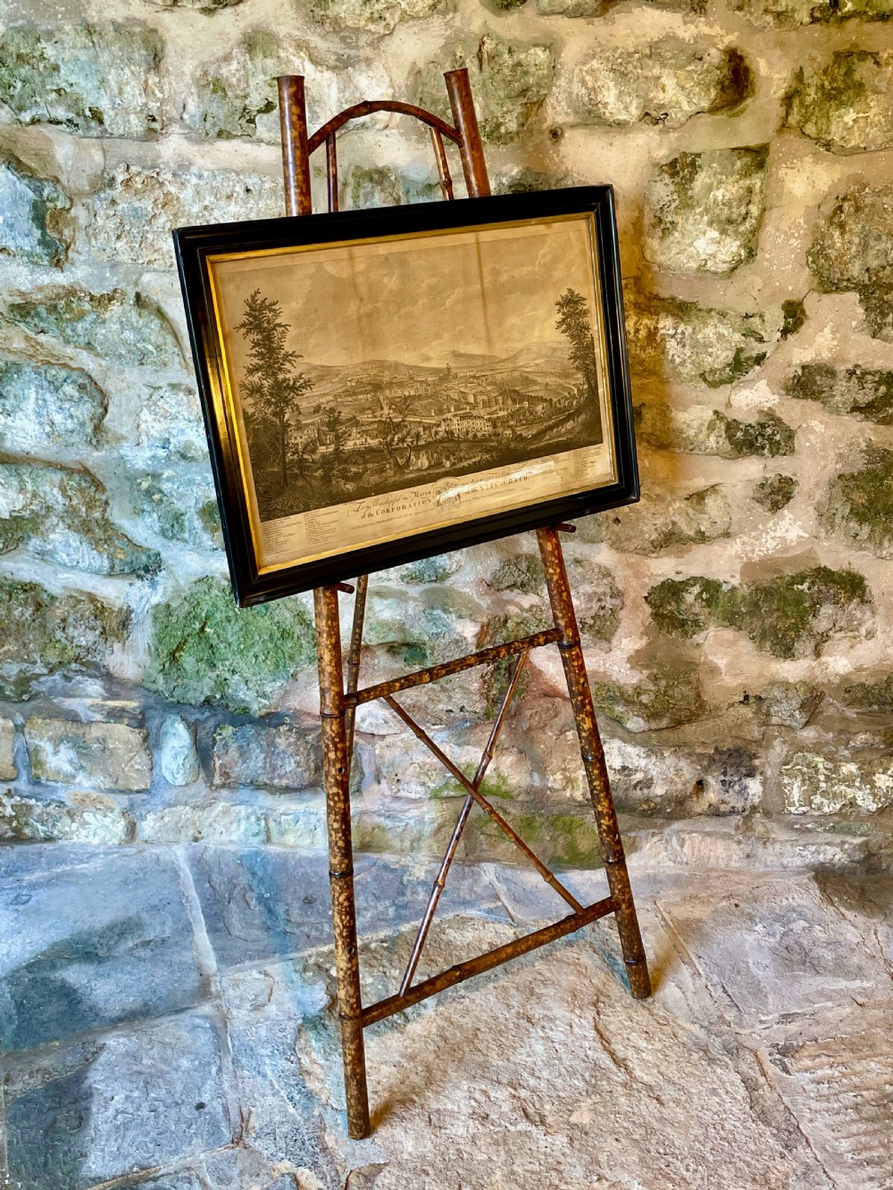 A tall Victorian freestanding easel crafted from mottled brown bamboo with cross-bracing and support pegs. View XXI