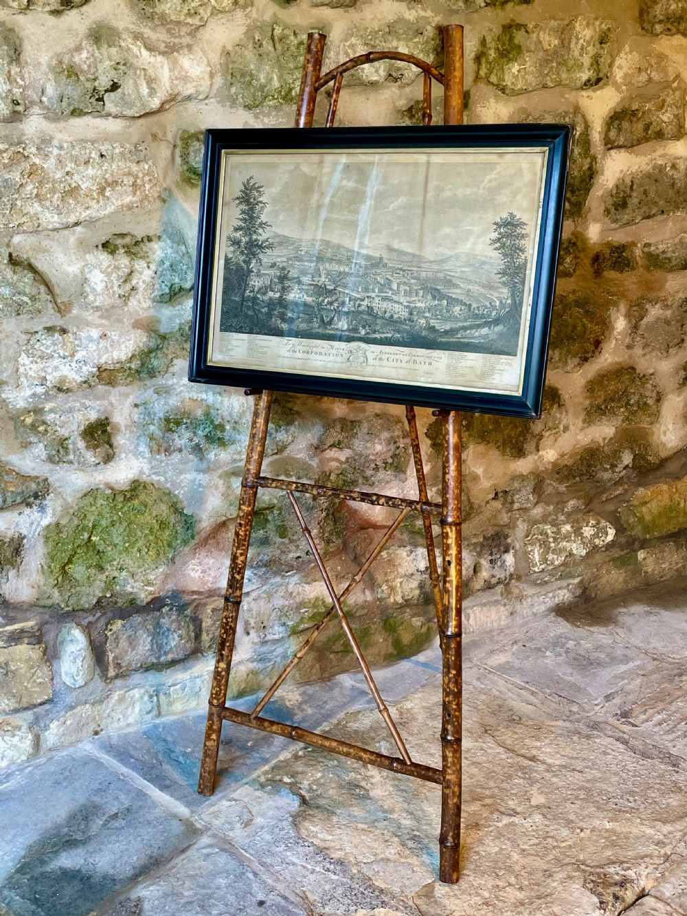 A tall Victorian freestanding easel crafted from mottled brown bamboo with cross-bracing and support pegs. View XXII