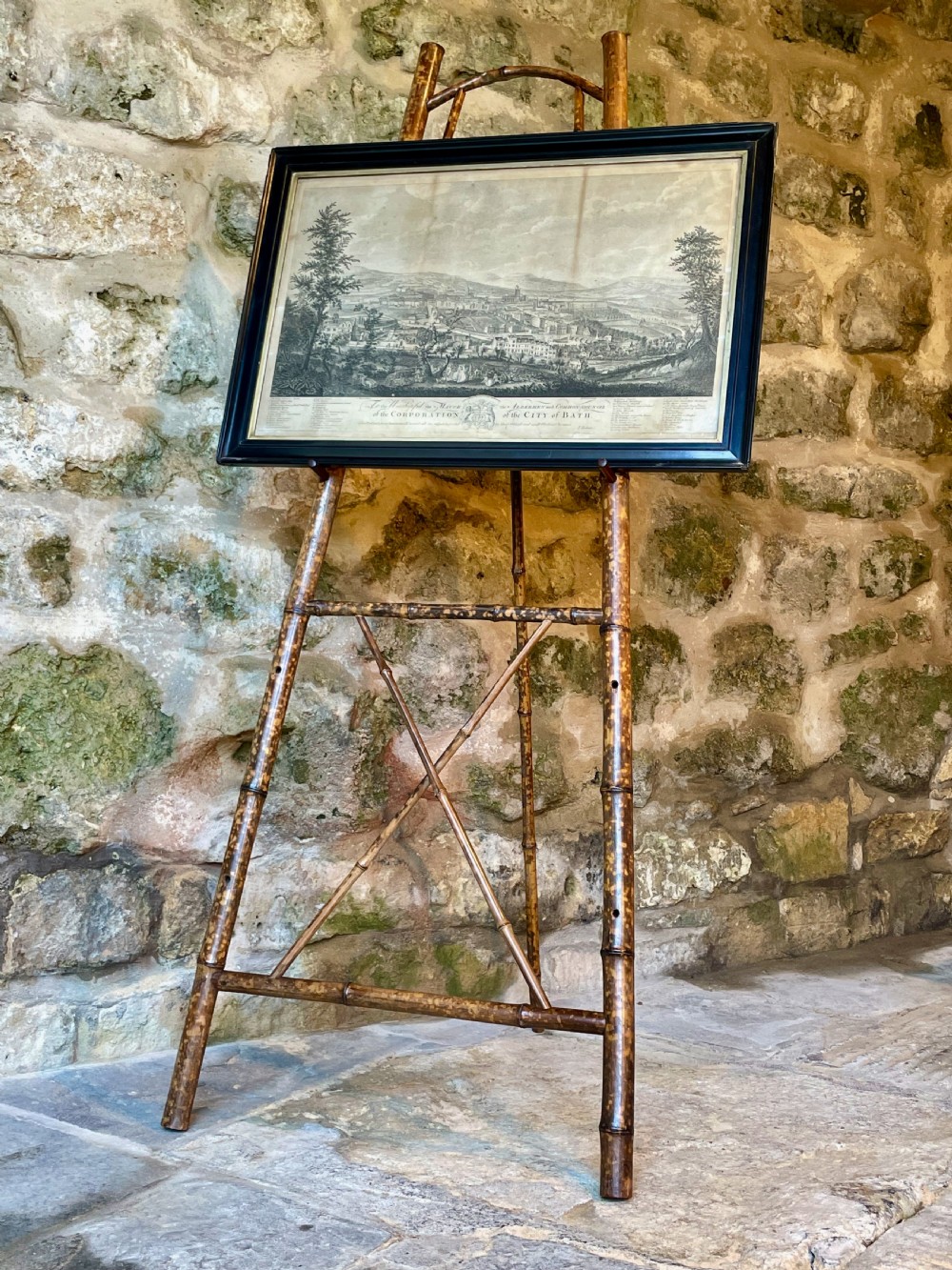 A tall Victorian freestanding easel crafted from mottled brown bamboo with cross-bracing and support pegs. View XXIII